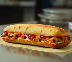 Buffalo Chicken Sandwich - Grilled chicken breast, creamy blue cheese sauce, fresh onions, hot buffalo sauce, cheddar and provolone cheese.
