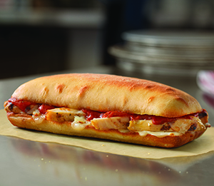 Chicken Parm Sandwich - Grilled chicken breast, tomato basil marinara, Parmesan-Asiago and provolone cheese. On artisan bread and baked to a golden brown.